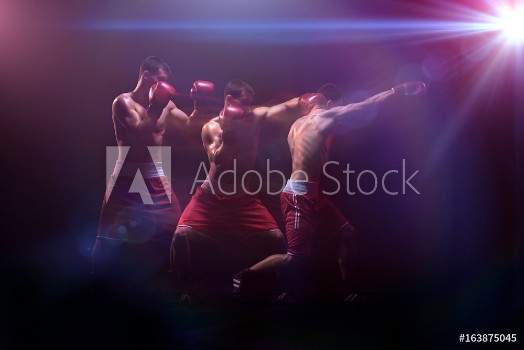 Picture of The boxer boxing in a dark studio